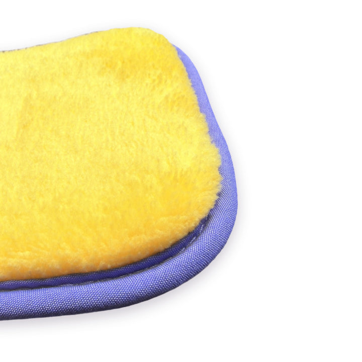 Close up of the Lash Link Cleansing Sponge showing the thick plush yellow microfibre and lilac edging