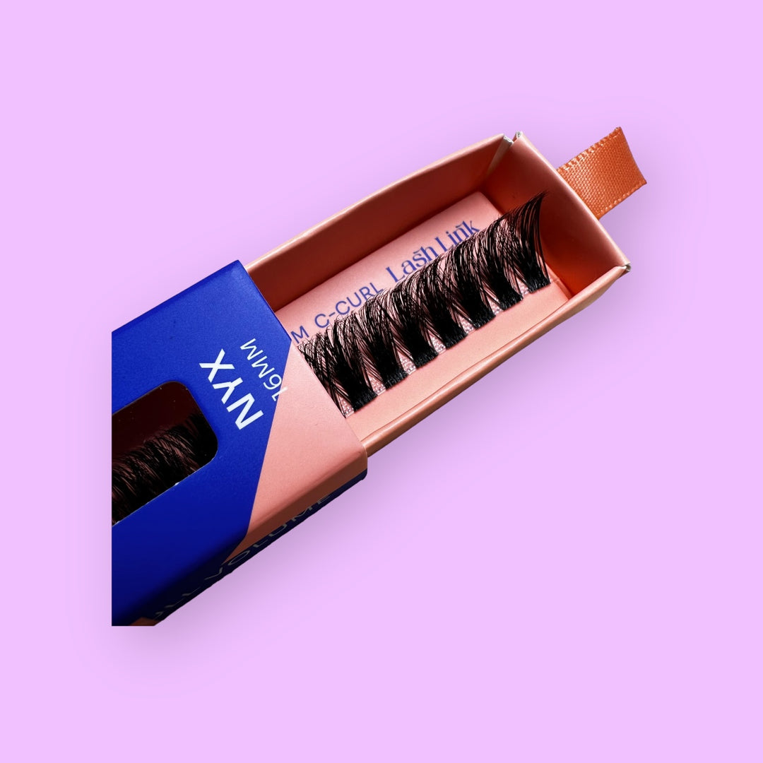 A close-up of a box of false eyelashes from the brand "Lash Link," showcasing the Lash Link DIY Eyelash Extension Kit inside the packaging against a purple background, perfect for those wanting to apply their own eyelash extensions at home.