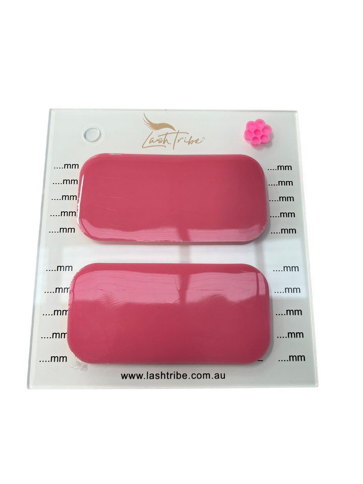 A pair of Mega Lash Tile | Left &amp; Right Handed nail polishes in a plastic container. (Brand: Lash Tribe)