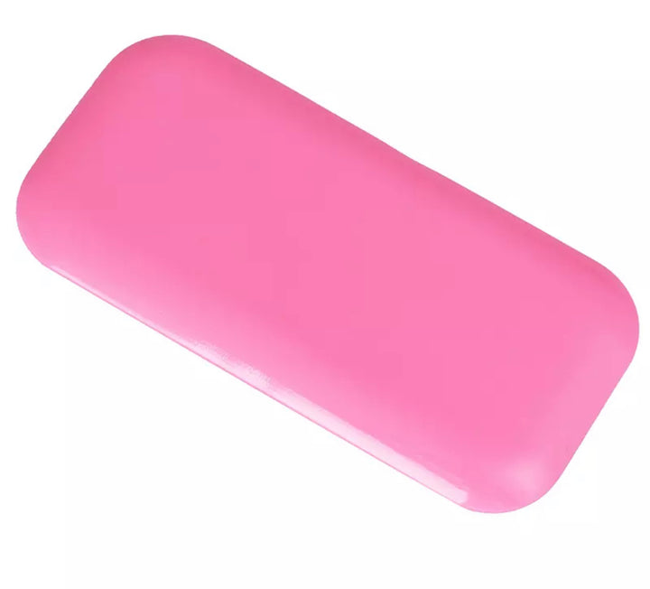 a Lash Tribe Silicone Lash Pad on a white surface.